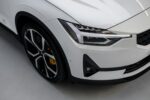a white car is parked in a garage assicurazione auto Milano