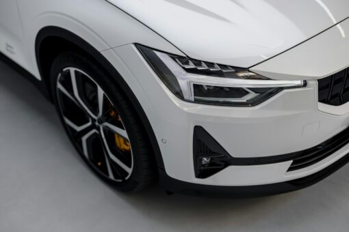 a white car is parked in a garage assicurazione auto Milano
