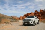 parked white Ford Explorer SUV noleggio auto Milano