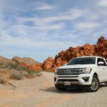 parked white Ford Explorer SUV noleggio auto Milano
