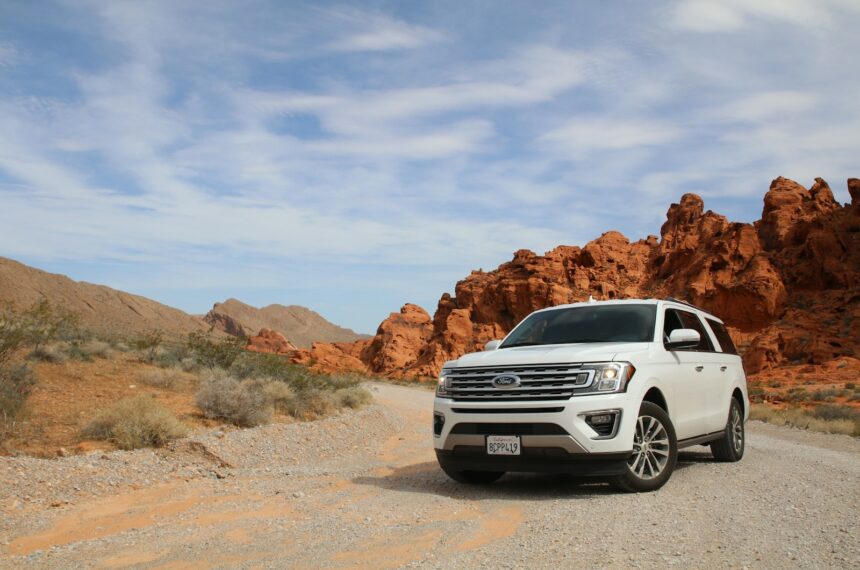 parked white Ford Explorer SUV noleggio auto Milano