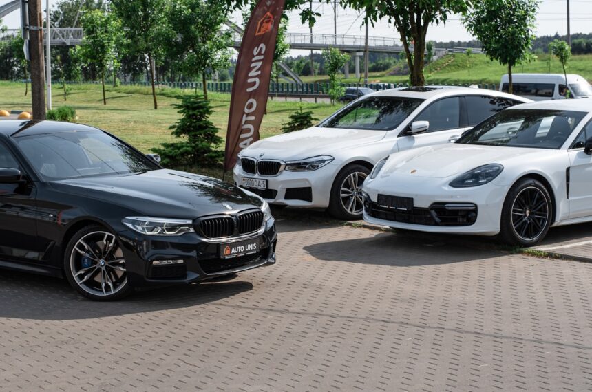 a group of cars parked on a brick road migliori concessionari auto Milano