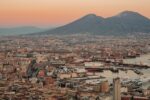 a view of a city with a mountain in the background