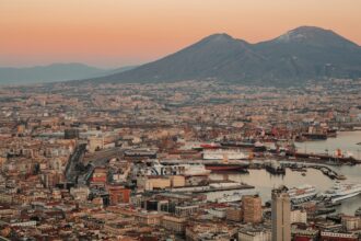 a view of a city with a mountain in the background
